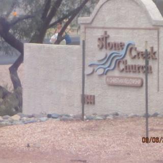 Sign for Stone Creek Church in an outdoor setting.
