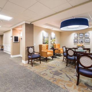 A well-lit lobby area featuring comfortable seating and elegant decor.