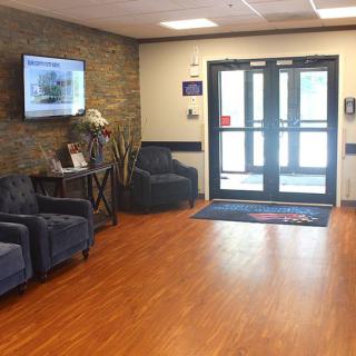 A cozy lobby area with comfortable seating and a welcoming entrance.