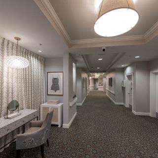 A modern and elegant hallway with tasteful lighting and decor.