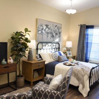 A cozy and modern bedroom featuring elegant decor and comfortable furniture.