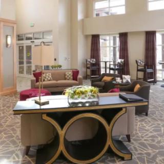 A modern hotel lobby with elegant furniture and decor.