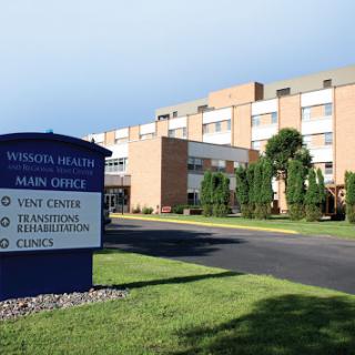 Exterior view of a healthcare facility with clear signage.