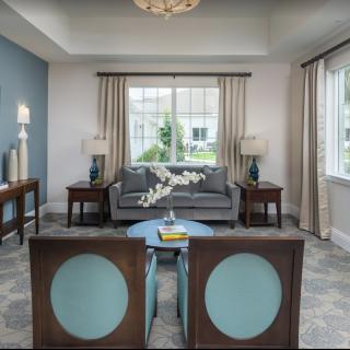 A well-decorated living room featuring elegant furniture and soft lighting.