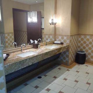 A well-designed bathroom interior featuring dual sinks and elegant lighting.
