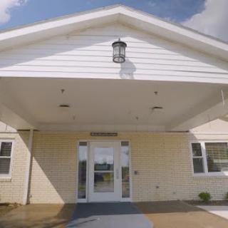 Entrance of a well-lit building with a welcoming design.