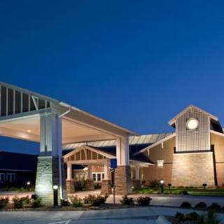 A modern building entrance illuminated at night.