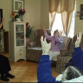 Residents engaged in a group activity at a care home.