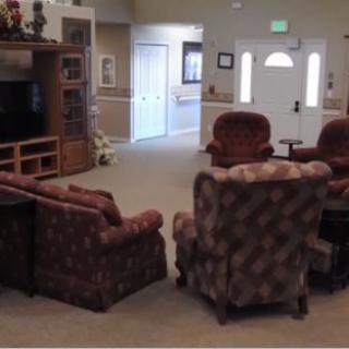 A cozy living room with comfortable seating and a television.