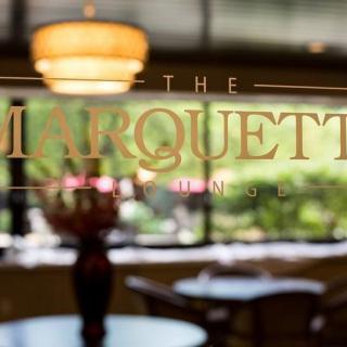 A view through the window of The Marquette, showcasing its elegant interior decor.