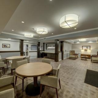 A modern lobby interior with seating areas and soft lighting.