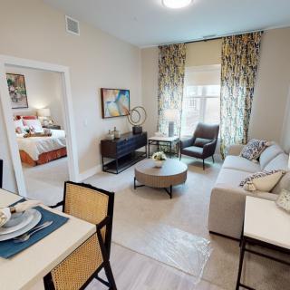 A modern and cozy living room with comfortable seating and stylish decor.