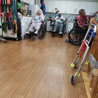 Residents engaging in activities at a care facility.