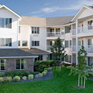 A well-maintained residential apartment complex with neatly landscaped grounds.