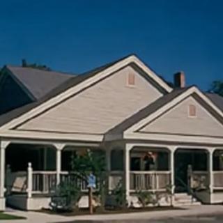 A charming residential house with a spacious porch.