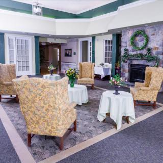 A cozy living room with comfortable seating and a fireplace.