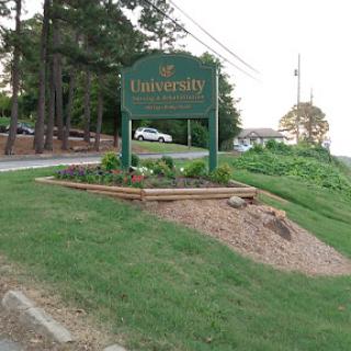 A welcoming sign marking the entrance to a university campus.