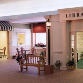 A cozy library area featuring comfortable seating and inviting decor.