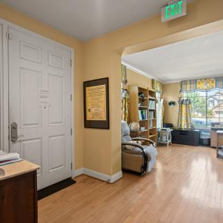 A welcoming waiting room with comfortable seating, natural lighting, and decorative elements.