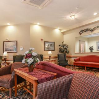 A cozy hotel lobby with comfortable seating and warm lighting.