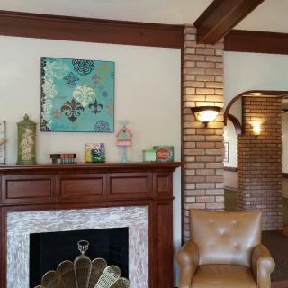 A cozy living room with a fireplace and stylish decor.