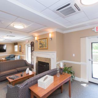A cozy living room with a fireplace and comfortable seating.