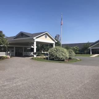 A peaceful view of a building set against a clear blue sky.