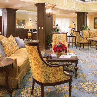 Elegant hotel lobby with classic furniture and luxurious decor.