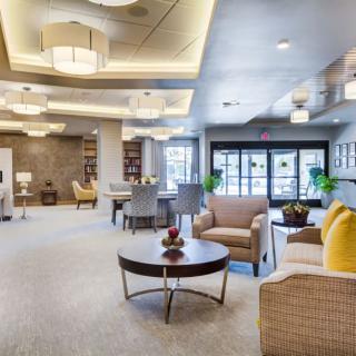 A modern, spacious lobby with comfortable seating and elegant lighting.