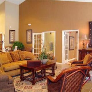 A cozy living room with warm tones and comfortable seating.