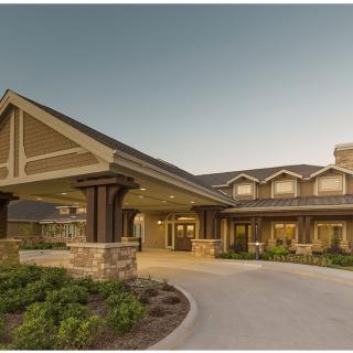 A residential building with a welcoming entrance and well-maintained landscaping.
