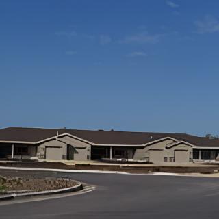A residential building with a clear blue sky in the background.