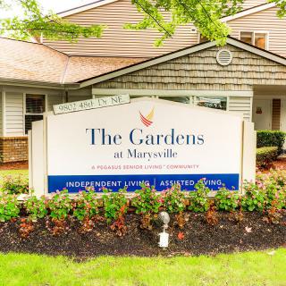 Sign for 'The Gardens at Marysville' in front of the facility.