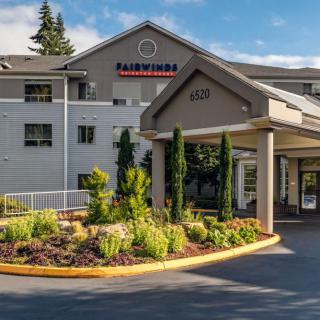 The exterior view of the Fairwinds hotel entrance with well-maintained landscaping.