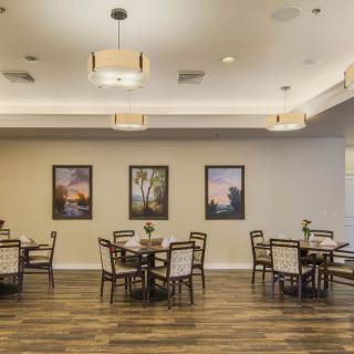 A spacious dining area with neatly arranged tables and stylish decor.