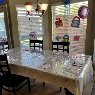 A beautifully decorated dining table ready for a celebration, complete with colorful decorations and a cozy ambiance.