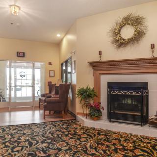 A cozy living room with a fireplace and elegant decor.
