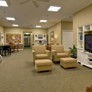 A cozy living room with comfortable seating and a television.