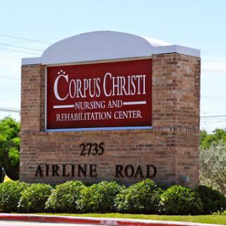 Sign for Corpus Christi Nursing and Rehabilitation Center located on Airline Road.