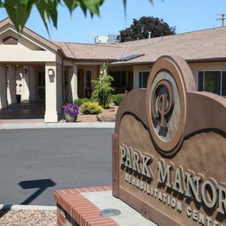Exterior view of the Park Manor Rehabilitation Center with its entrance and signage.