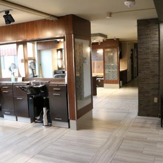 A modern barber shop interior featuring sleek styling stations and a welcoming atmosphere.