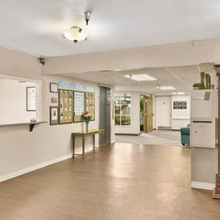 Spacious and welcoming lobby with a reception desk and seating area.