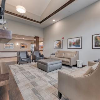 A modern living room with comfortable seating and elegant decor.