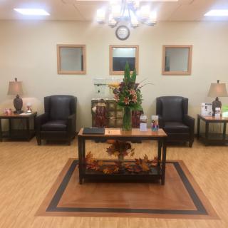 A welcoming waiting room with comfortable seating and elegant decor.