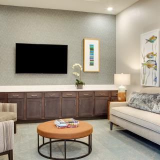Modern living room with stylish furniture and decor.