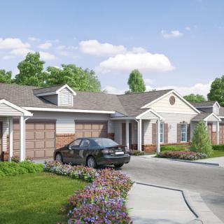 A suburban residential area with single-story houses, driveways, and well-maintained landscaping.