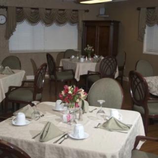A cozy restaurant dining area with neatly arranged tables and chairs.