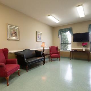 A cozy waiting room with comfortable seating and ambient lighting.
