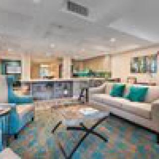 A modern living room with stylish furnishings and cozy ambiance.