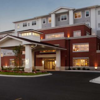An exterior view of a hotel with a welcoming entrance.